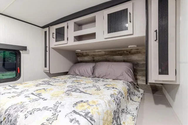 a view of backyard with seating space and trees