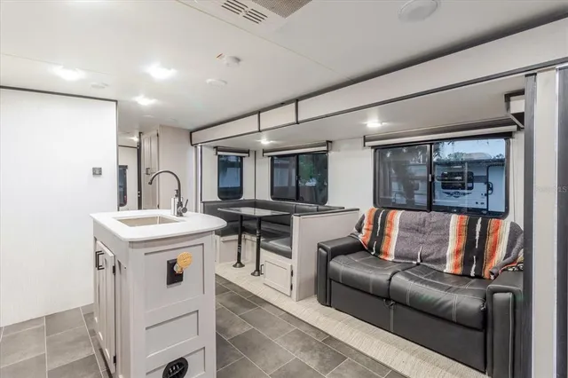 a view of balcony with wooden floor and outdoor seating