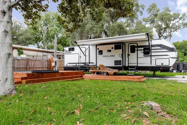 swimming pool view with a seating space