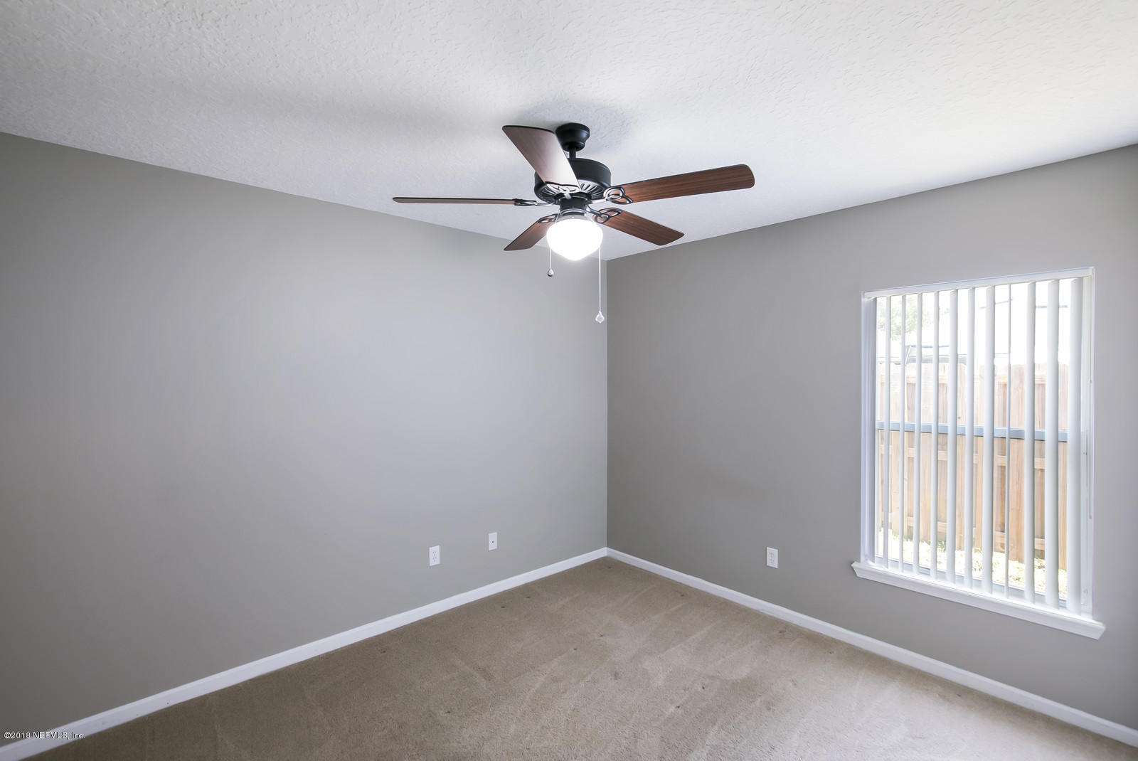 4316 Rye Court Jacksonville, FL 32259 - Photo 11 of 23 an empty room with a window and a fan