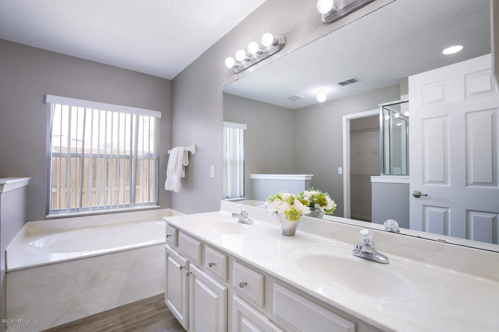 4316 Rye Court Jacksonville, FL 32259 - Photo 17 of 23 a bathroom with a tub double sink and mirror
