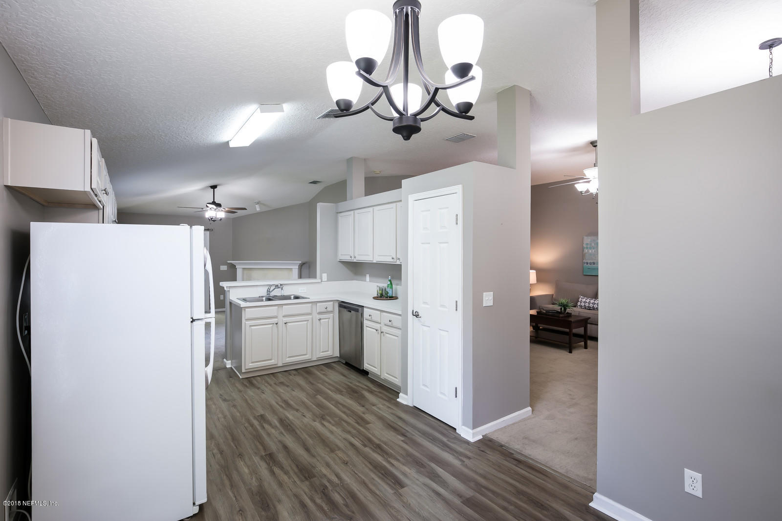 4316 Rye Court Jacksonville, FL 32259 - Photo 19 of 23 a kitchen with a refrigerator a stove top oven a sink and dishwasher