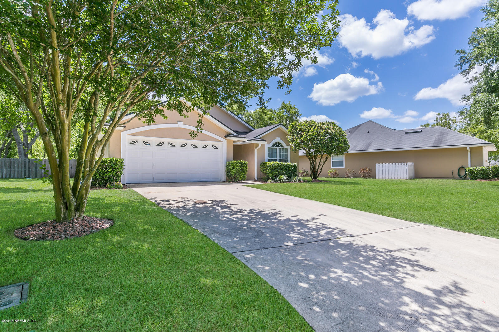 4316 Rye Court Jacksonville, FL 32259 - Photo 23 of 23 a front view of a house with a garden and trees