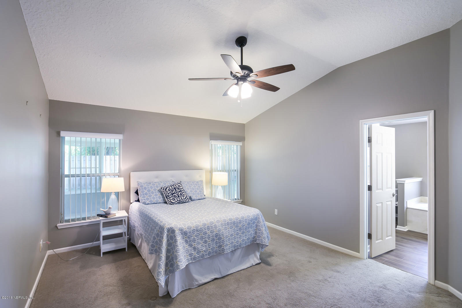 4316 Rye Court Jacksonville, FL 32259 - Photo 5 of 23 a bedroom with a bed and a ceiling fan