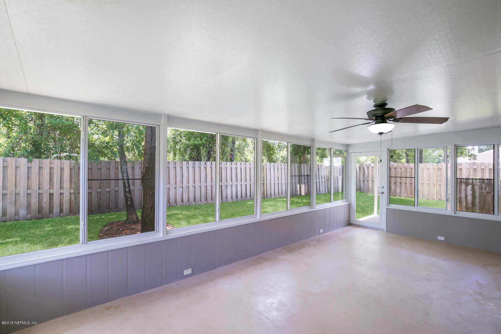 4316 Rye Court Jacksonville, FL 32259 - Photo 7 of 23 a view of an empty room with wooden floor and a fireplace