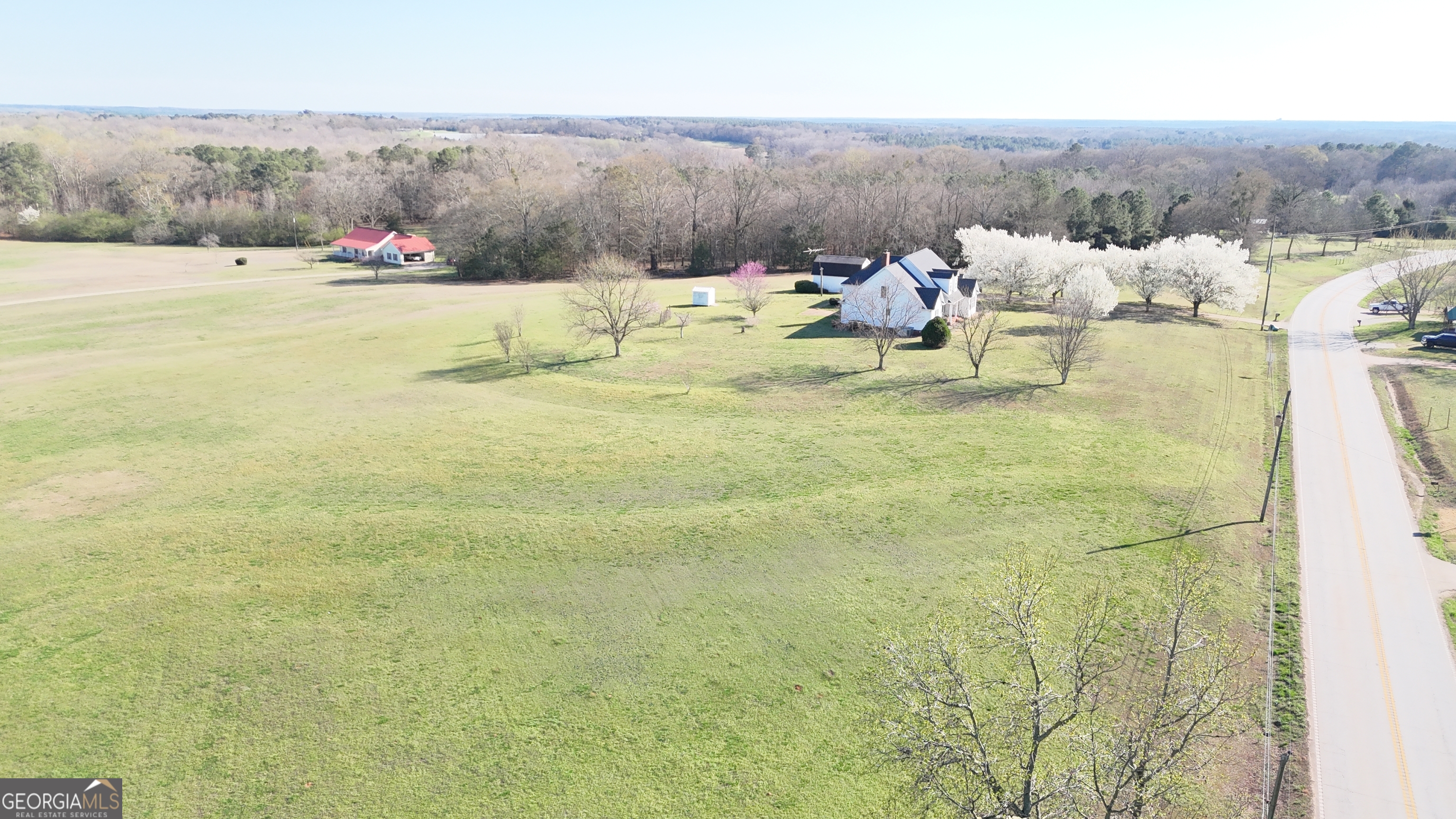 494 Broad Street Bowman, GA 30624 - Photo 59 of 65 a view of a lake with couches and city view