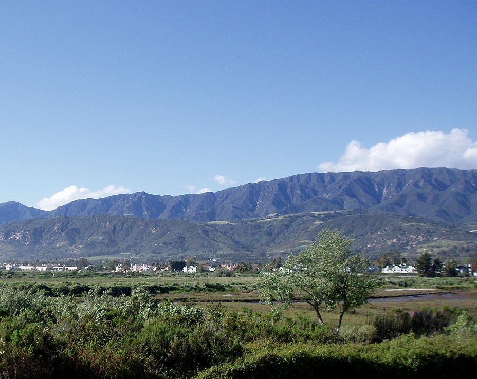4700 Sandyland Road, Unit 58 Carpinteria, CA 93013 - Photo 12 of 12 a view of a lush green field with mountains in the background