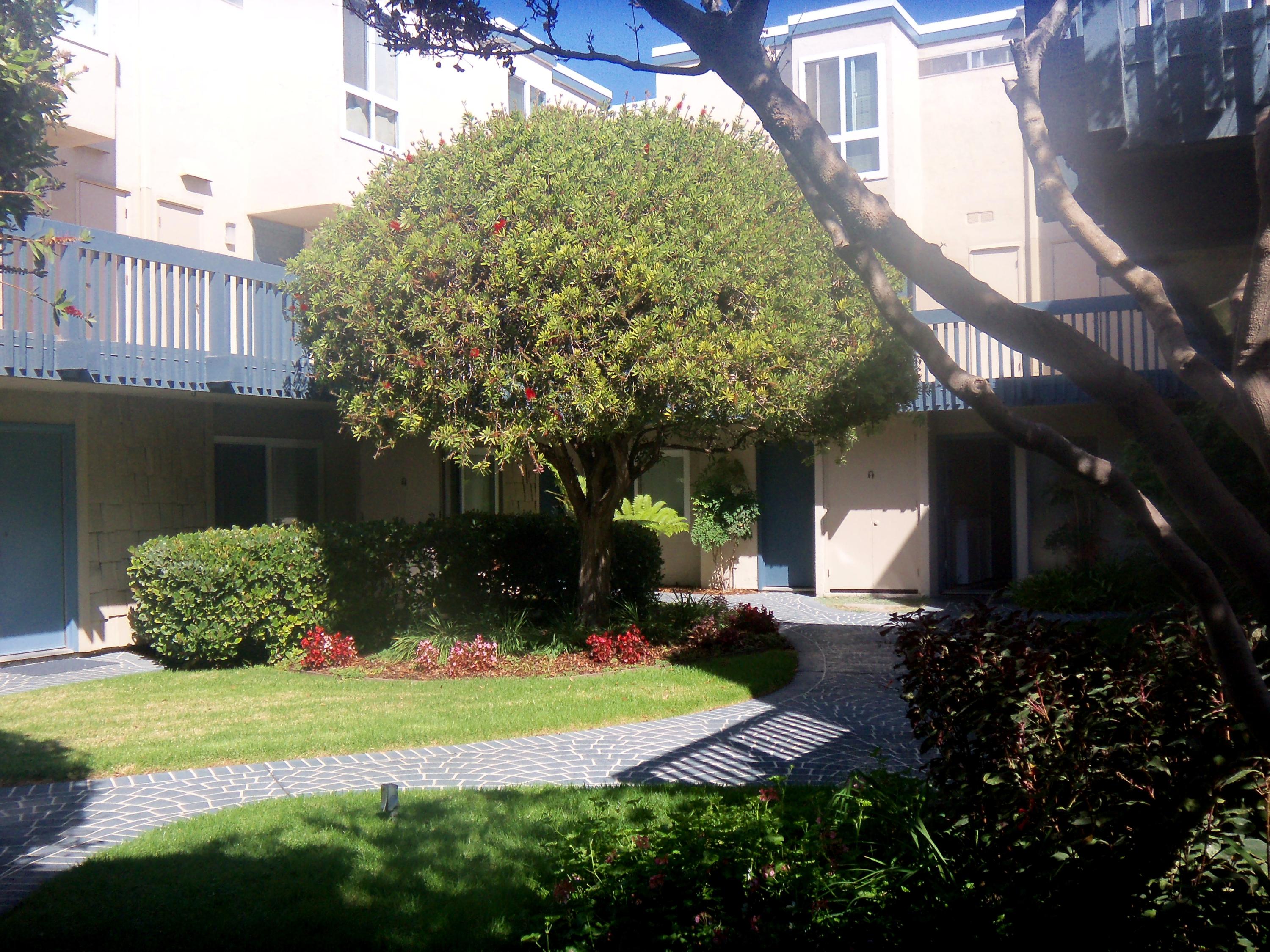 4700 Sandyland Road, Unit 58 Carpinteria, CA 93013 - Photo 8 of 12 a view of a house with a yard and garden