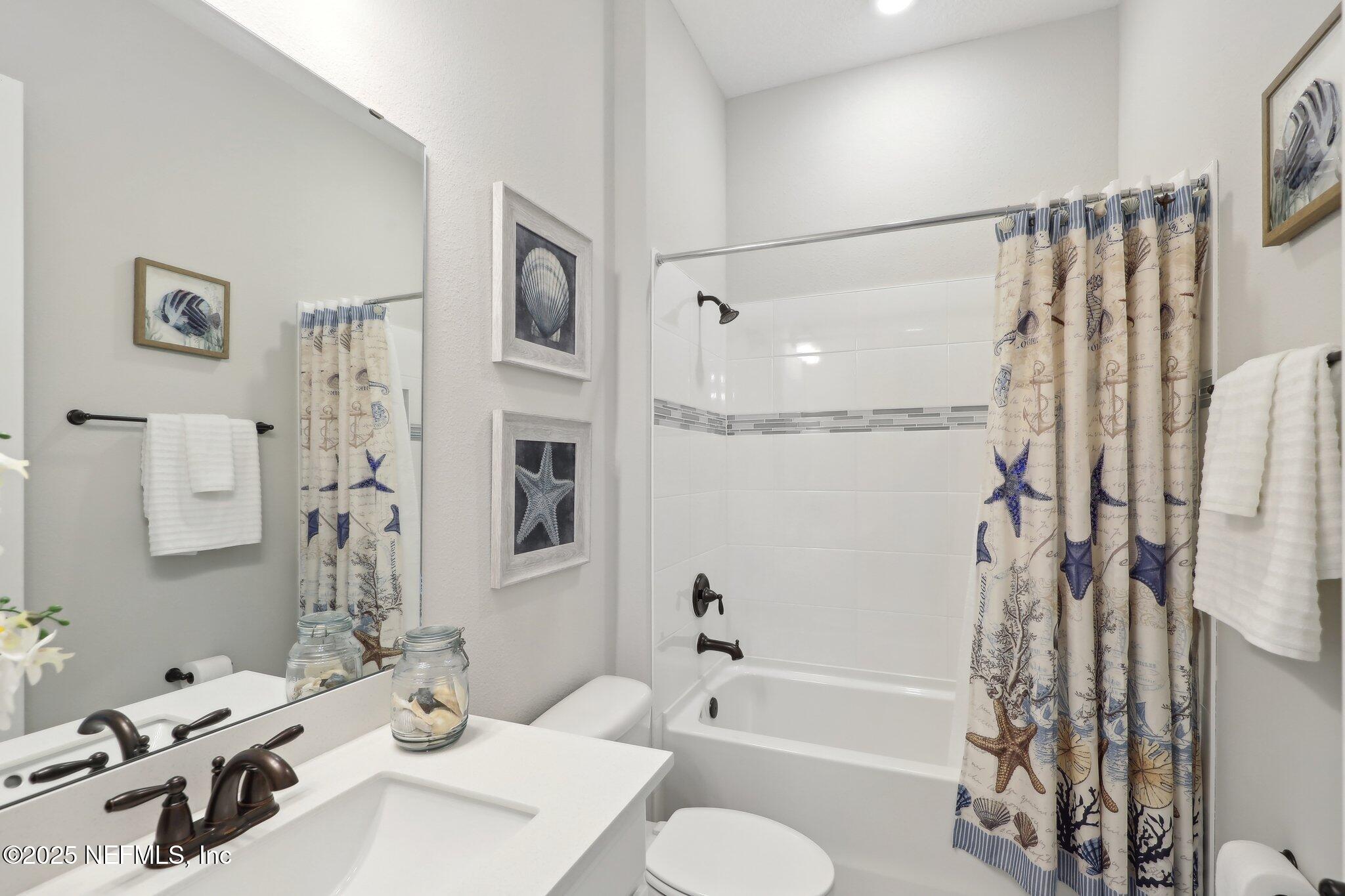 406 Navigators Road St. Johns, FL 32259 - Photo 13 of 57 a bathroom with a sink toilet and shower