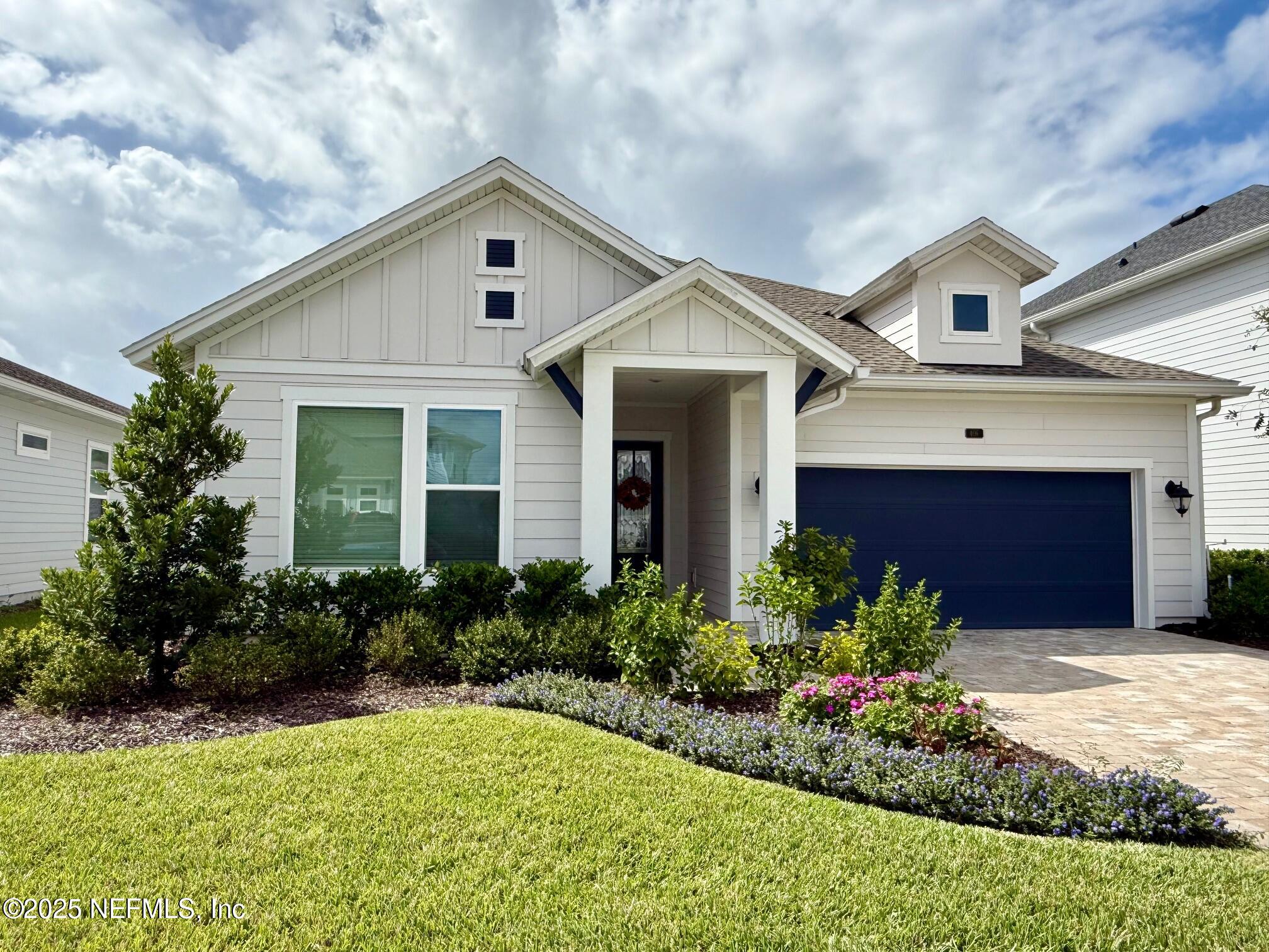 406 Navigators Road St. Johns, FL 32259 - Photo 2 of 57 a front view of house with yard and green space