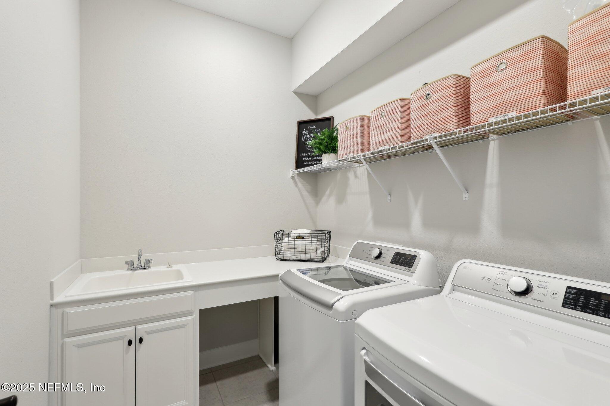 406 Navigators Road St. Johns, FL 32259 - Photo 32 of 57 a utility room with dryer and washer