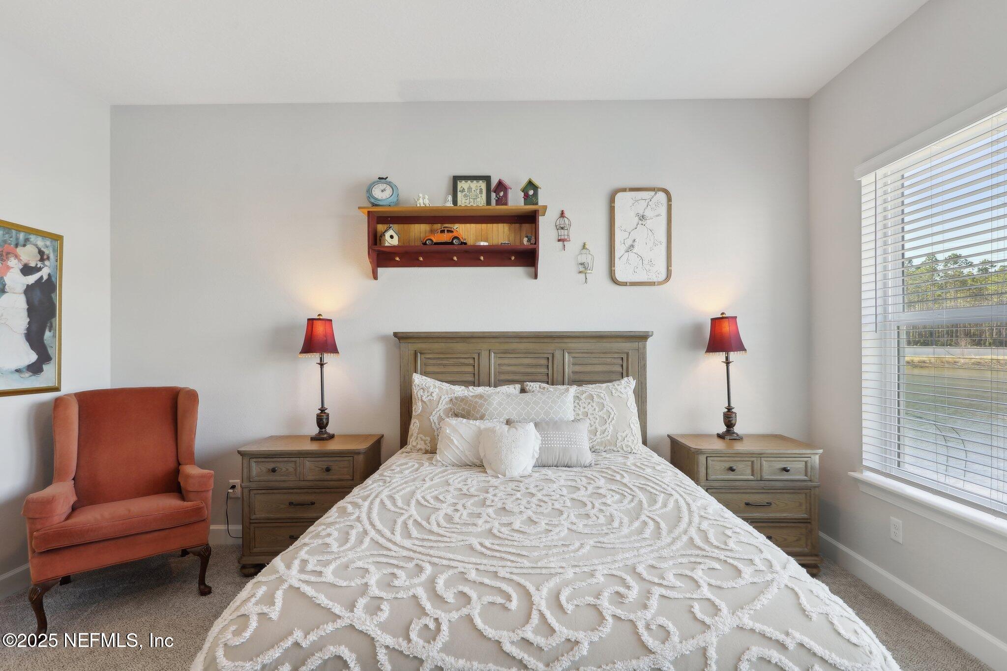 406 Navigators Road St. Johns, FL 32259 - Photo 36 of 57 a bedroom with furniture and a window