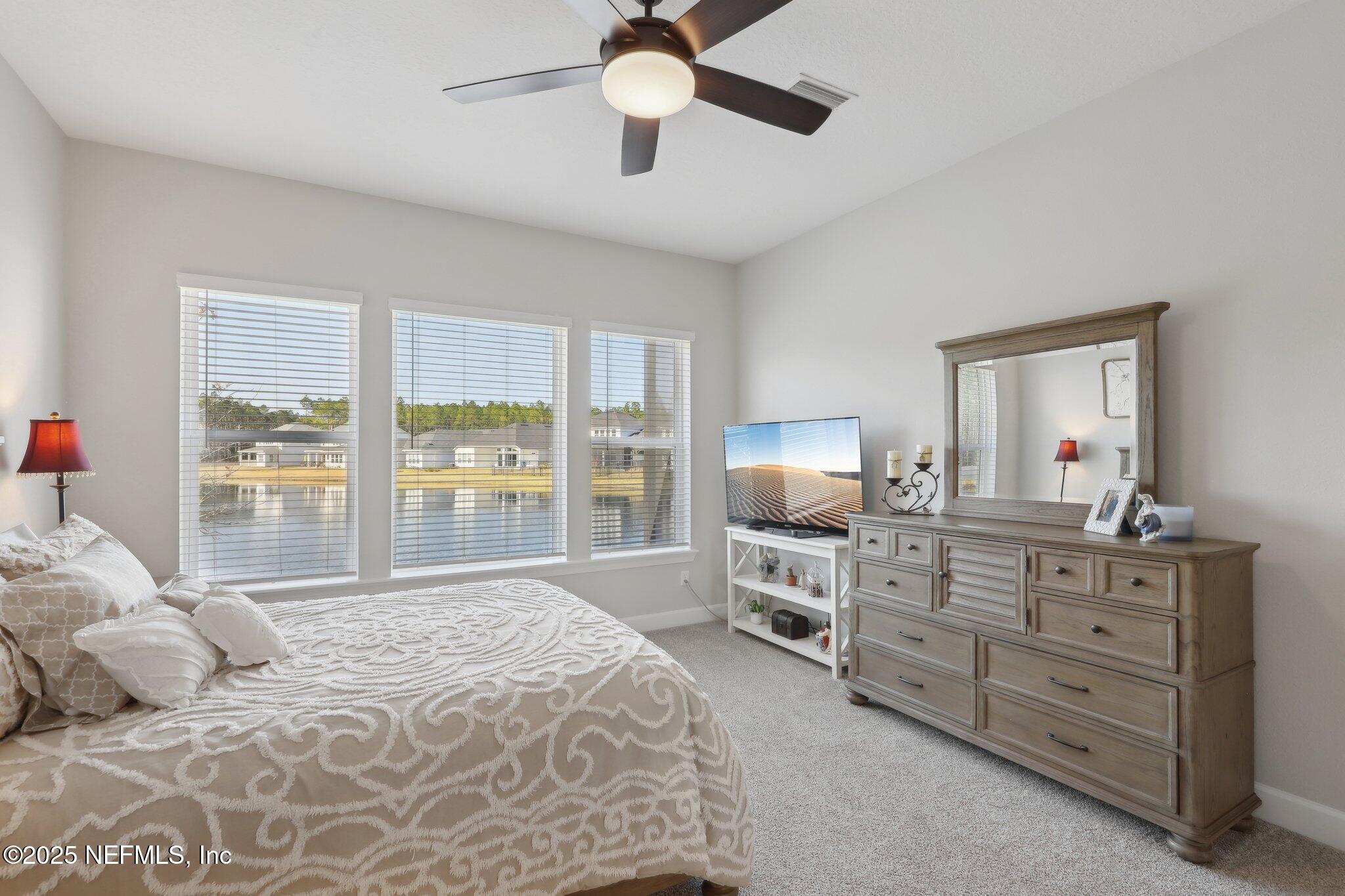 406 Navigators Road St. Johns, FL 32259 - Photo 39 of 57 a bedroom with a bed and a large bed
