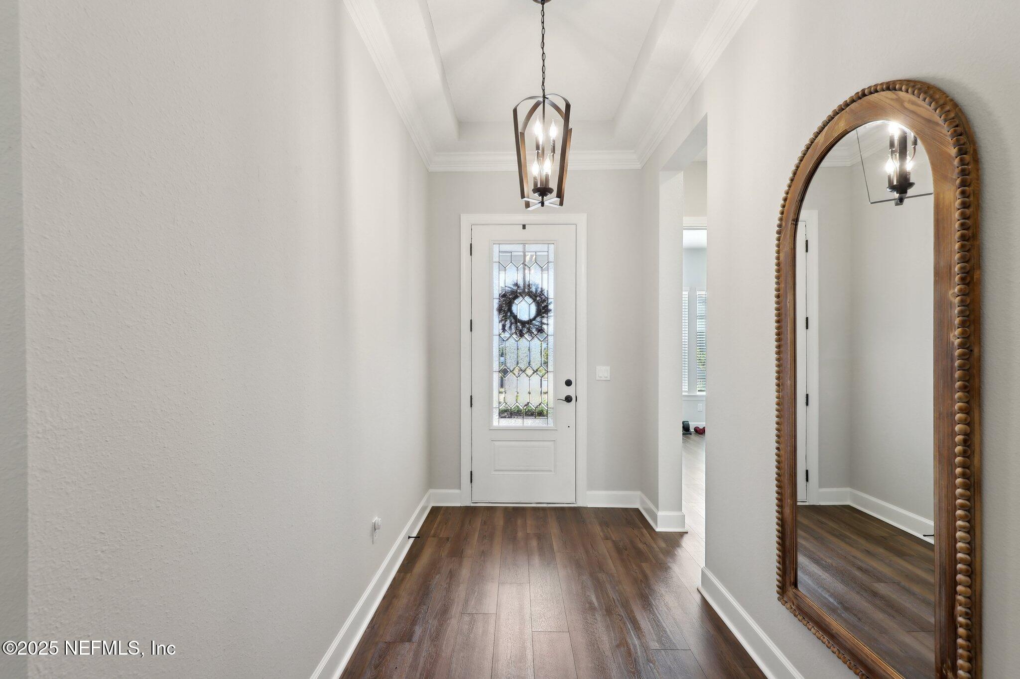 406 Navigators Road St. Johns, FL 32259 - Photo 4 of 57 a view of a livingroom with wooden floor and window