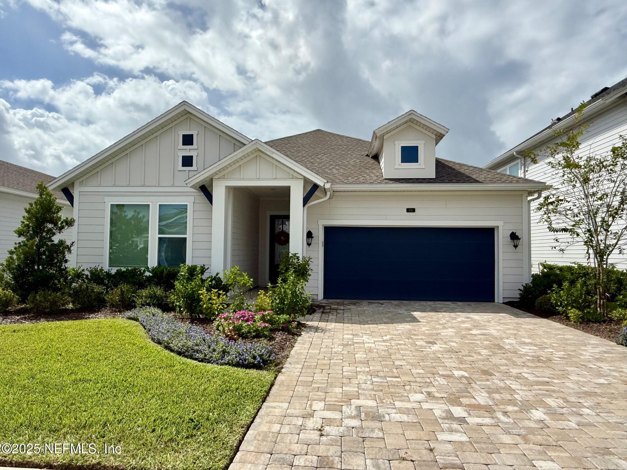 406 Navigators Road St. Johns, FL 32259 - Photo 46 of 57 a front view of a house with a yard and garage