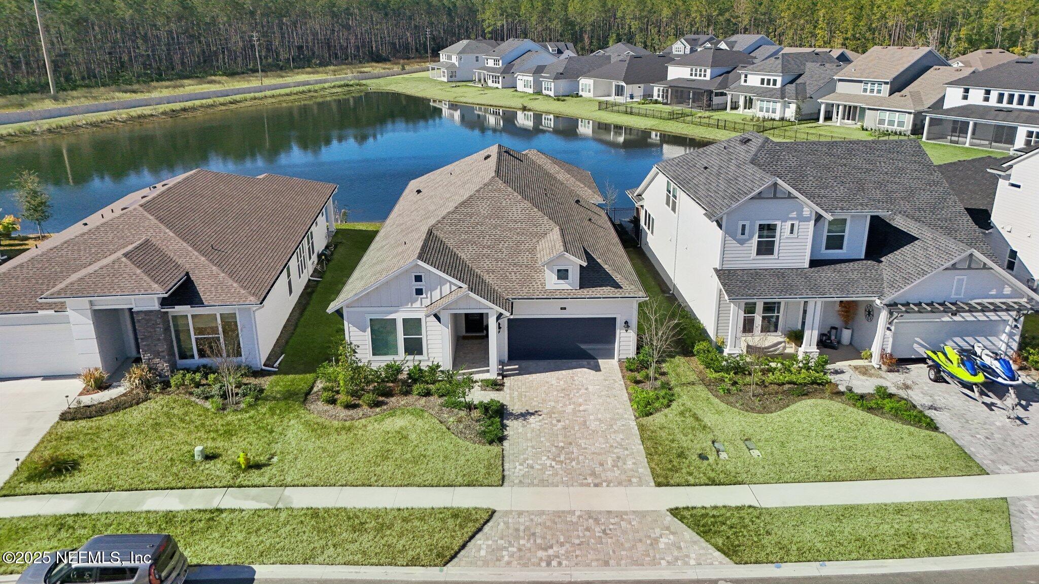 406 Navigators Road St. Johns, FL 32259 - Photo 51 of 57 an aerial view of house with outdoor space and lake view