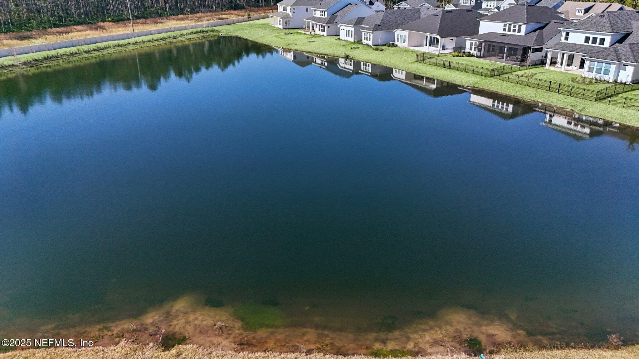 406 Navigators Road St. Johns, FL 32259 - Photo 52 of 57 a view of a lake with a houses