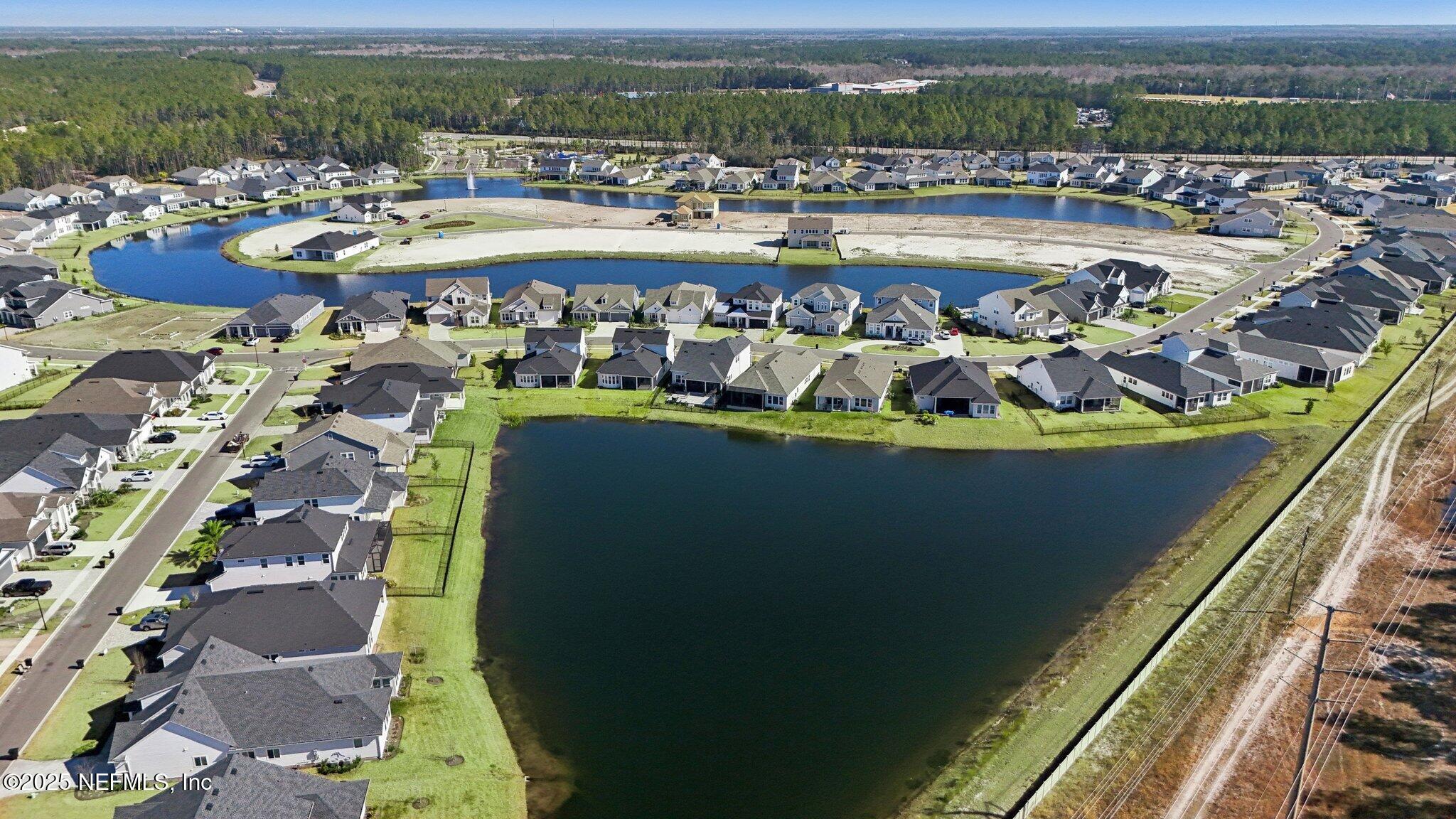 406 Navigators Road St. Johns, FL 32259 - Photo 54 of 57 a view of a swimming pool with a lake view