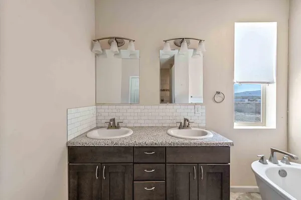 a bathroom with a bathtub and a sink