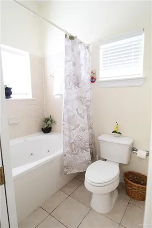 a bathroom with a toilet a sink and bathtub