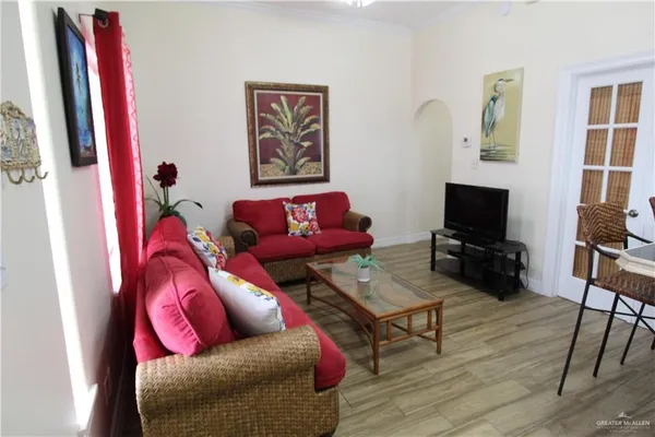 a living room with furniture and a flat screen tv