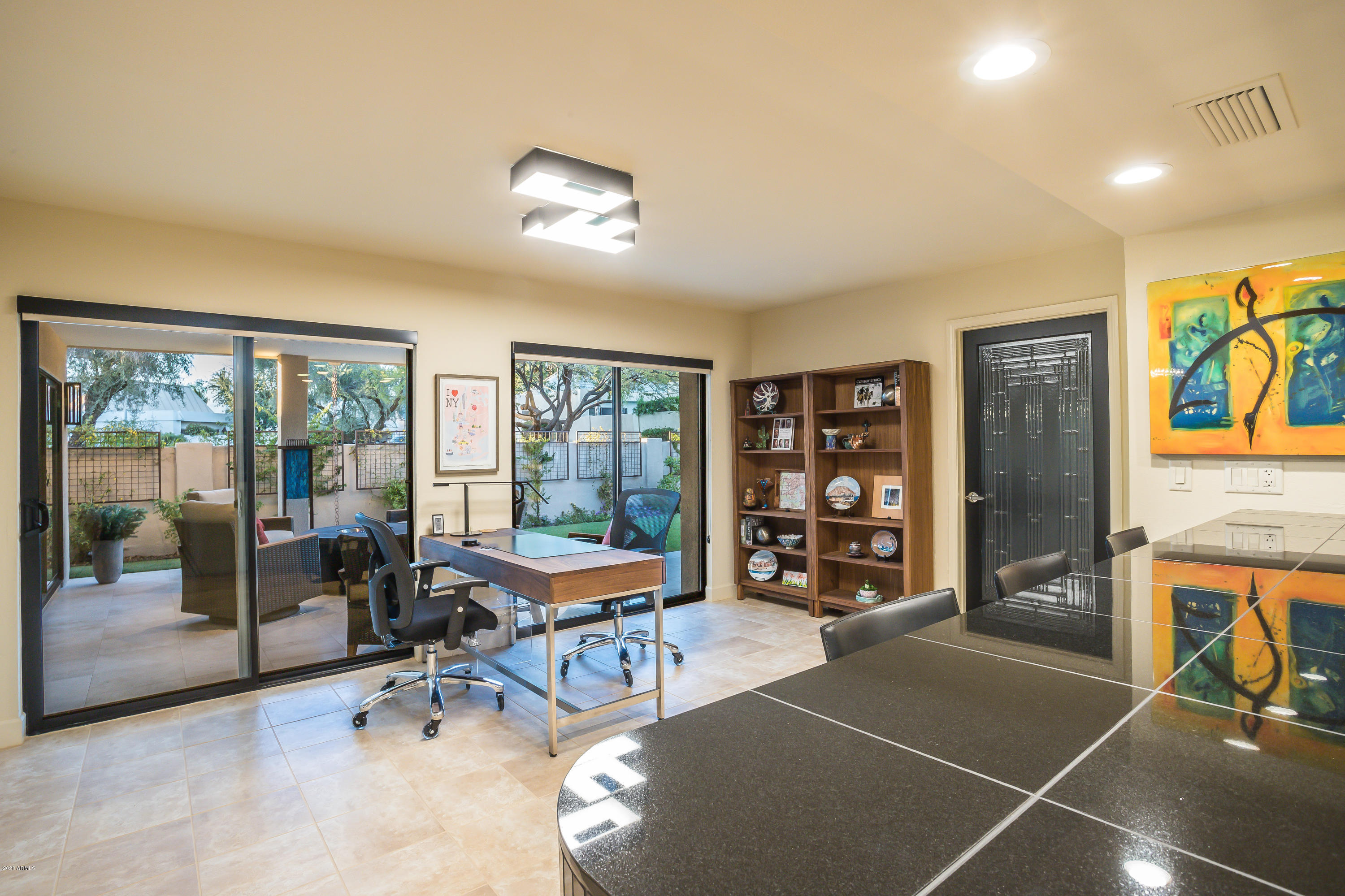 5309 North 24th Place Phoenix, AZ 85016 - Photo 13 of 49 a living room with furniture a dining table and a large window
