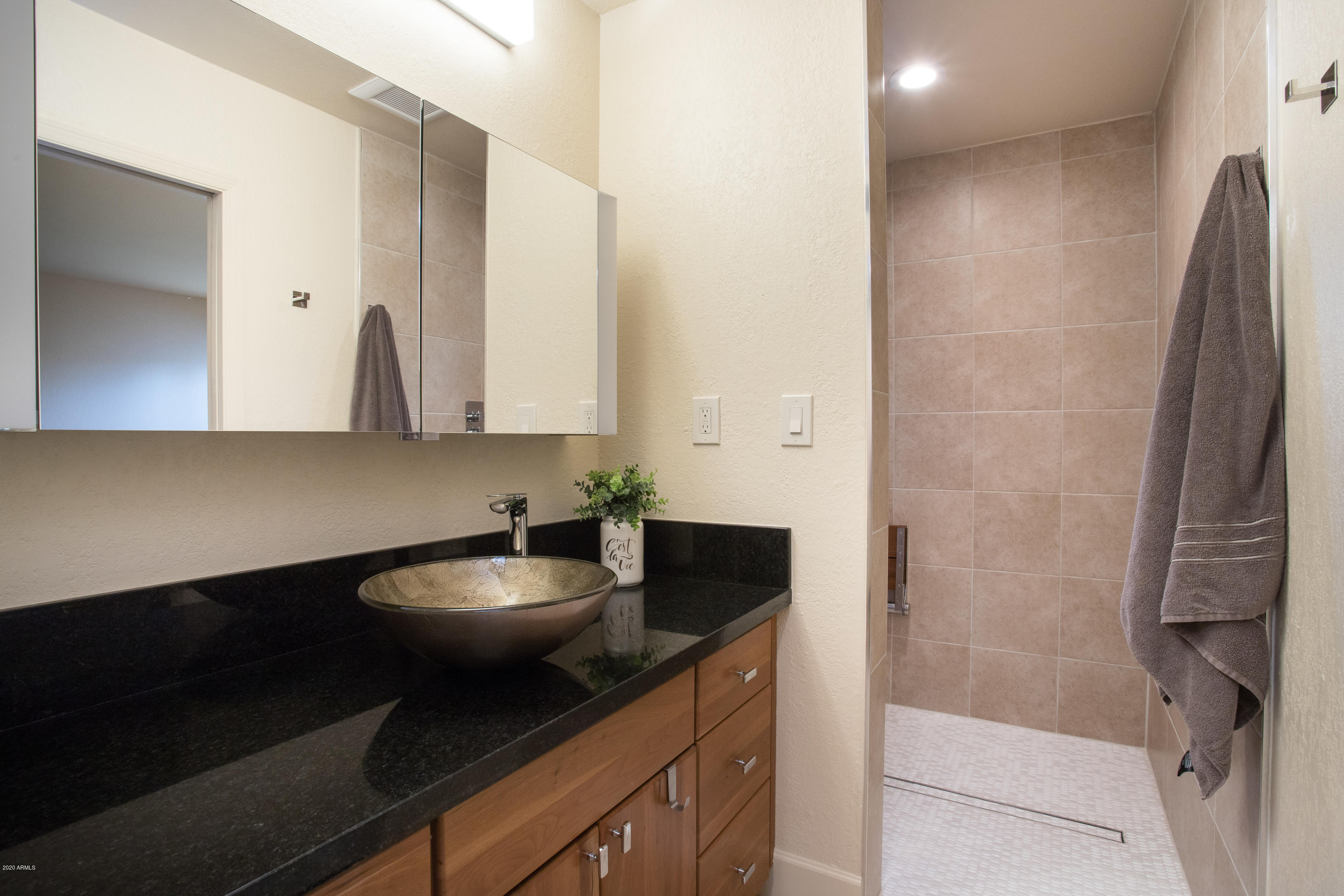 5309 North 24th Place Phoenix, AZ 85016 - Photo 21 of 49 a kitchen with a sink and cabinets