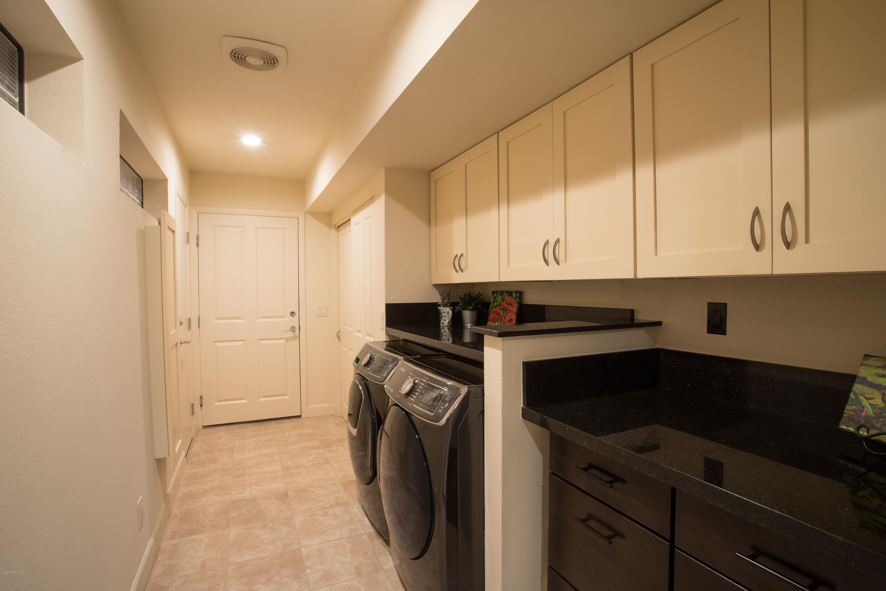 5309 North 24th Place Phoenix, AZ 85016 - Photo 24 of 49 a kitchen with a sink and cabinets