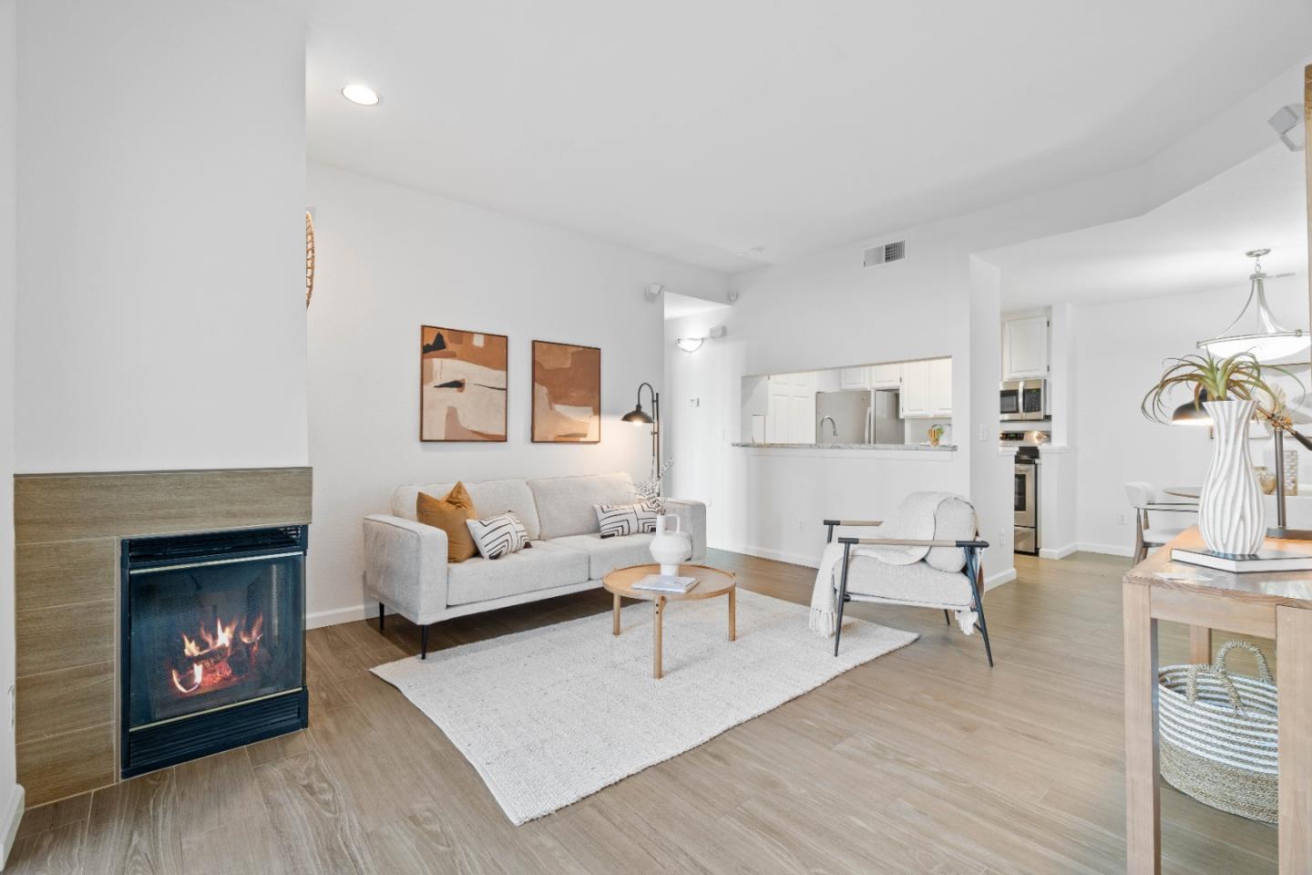 1770 Bevin Brook Drive San Jose, CA 95112 - Photo 1 of 32 a living room with furniture and a fireplace