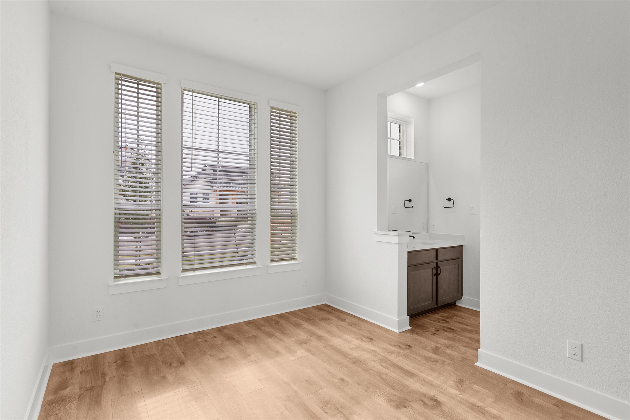 2312 Tobiano Trace Georgetown, TX 78633 - Photo 6 of 33 Bright interior space with wood-finish flooring