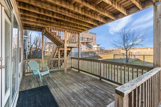 a view of a balcony with wooden floor