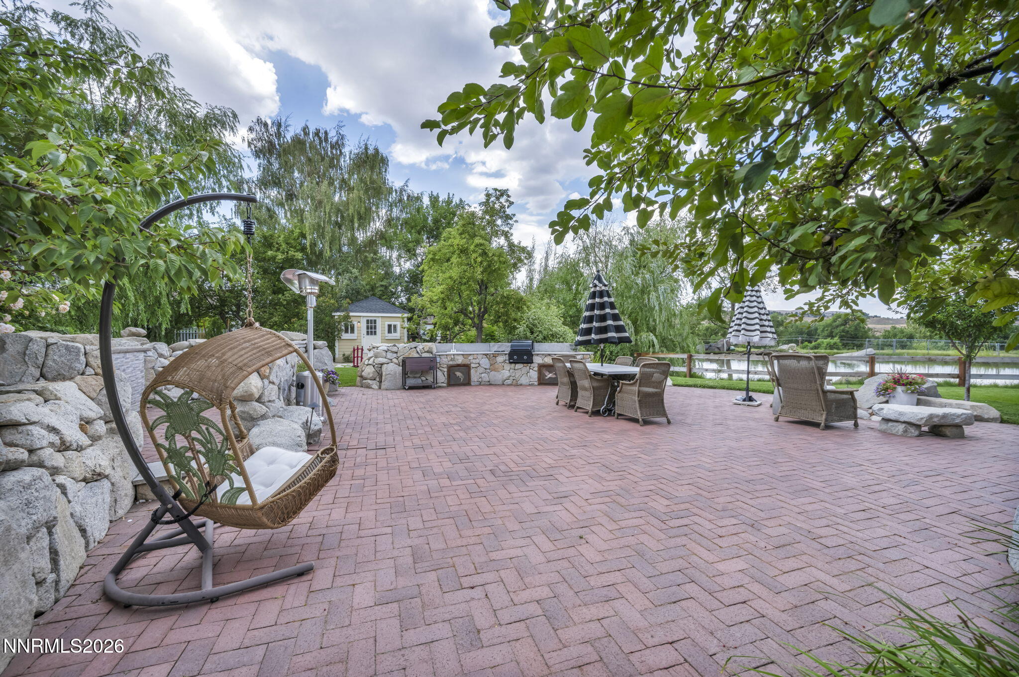 4010 Canyon Drive Reno, NV 89519 - Photo 102 of 147 a view of a patio with table and chairs potted plants and barbeque oven