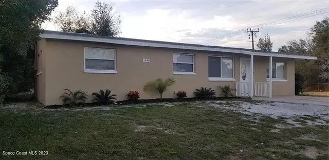 a backyard of a house with lots of green space