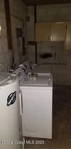 a utility room with washer and dryer