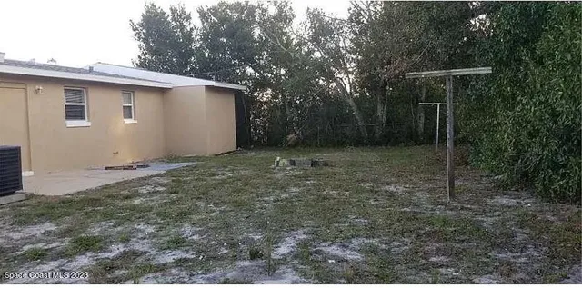 a backyard of a house with lots of green space