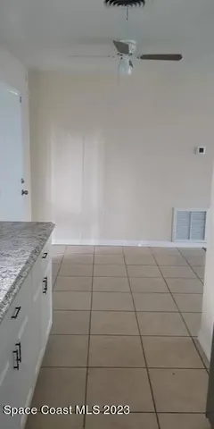 a view of a refrigerator in kitchen