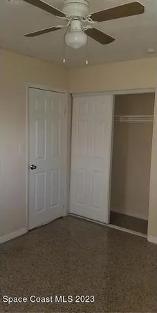 an empty room with fan