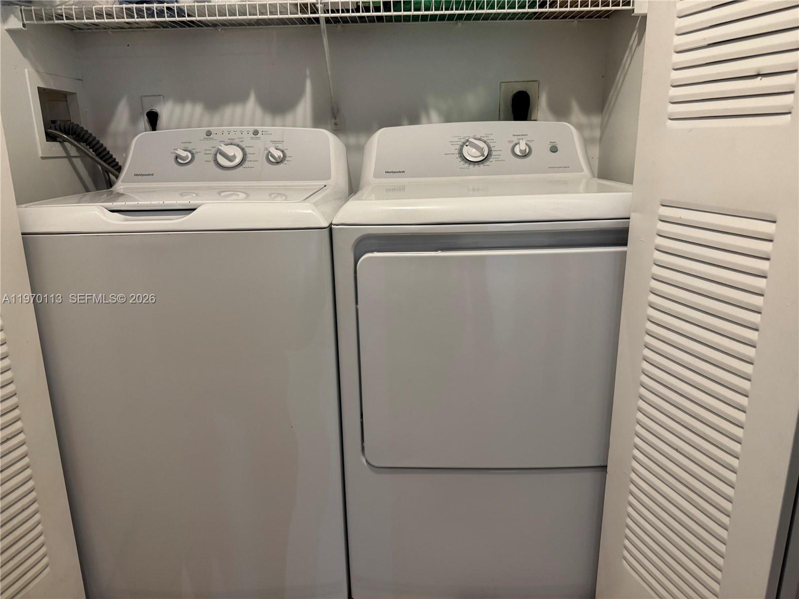 2091 Renaissance Boulevard, Unit 104 Miramar, FL 33025 - Photo 13 of 31 a utility room with dryer and washer