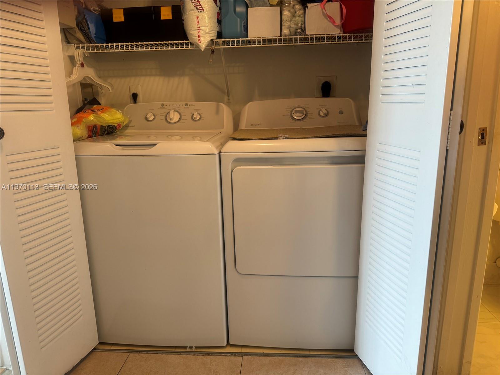 2091 Renaissance Boulevard, Unit 104 Miramar, FL 33025 - Photo 14 of 31 a utility room with dryer and washer
