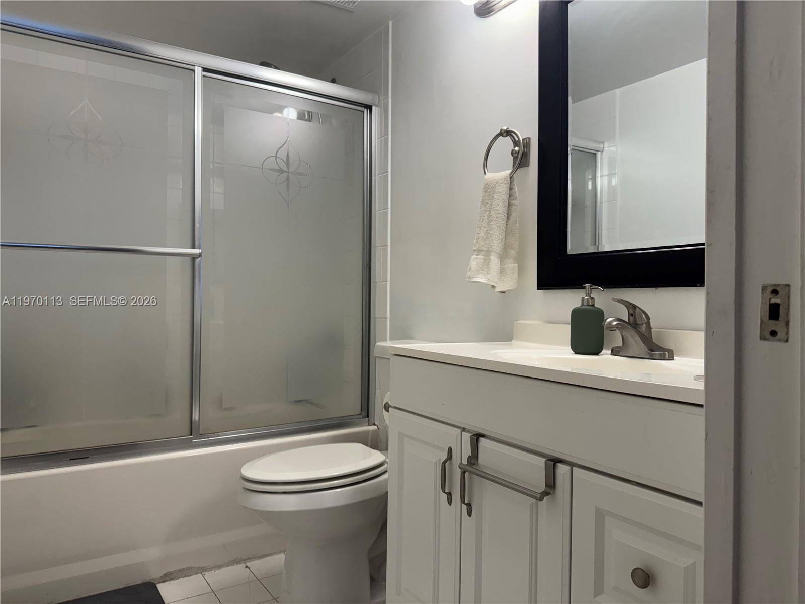 2091 Renaissance Boulevard, Unit 104 Miramar, FL 33025 - Photo 15 of 31 a bathroom with a sink a toilet and shower