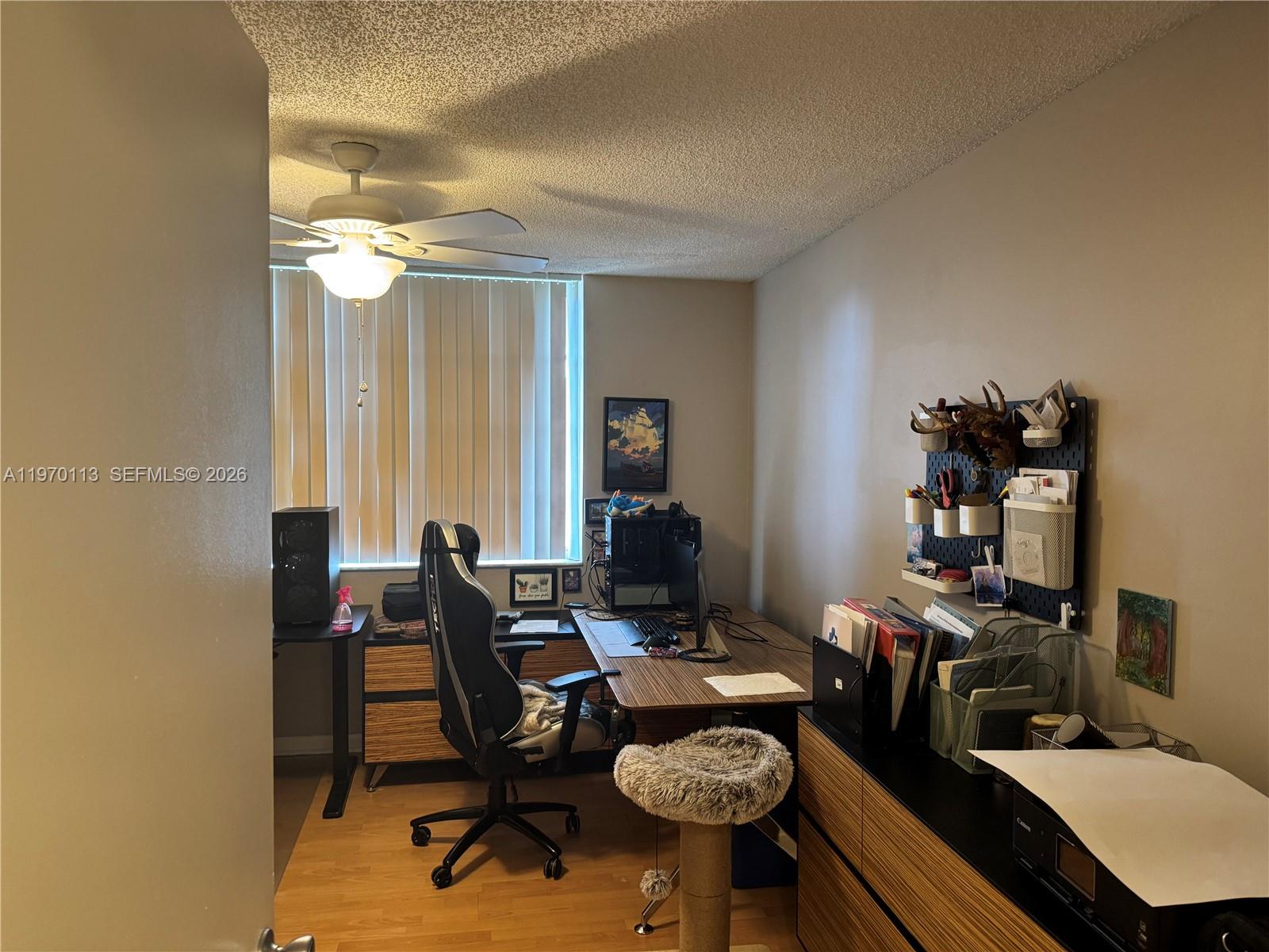 2091 Renaissance Boulevard, Unit 104 Miramar, FL 33025 - Photo 17 of 31 a view of a workspace with furniture