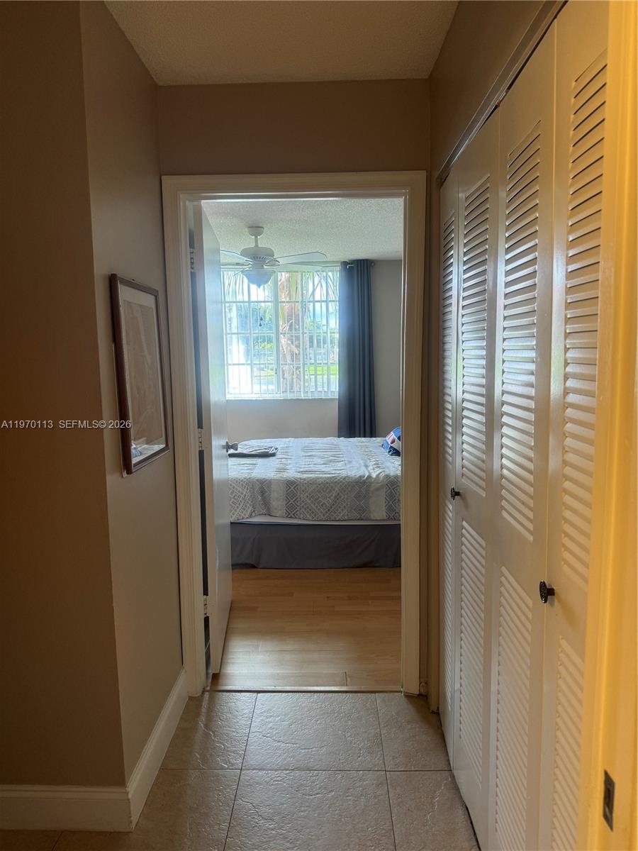 2091 Renaissance Boulevard, Unit 104 Miramar, FL 33025 - Photo 23 of 31 a bathroom with a tub shower and sink