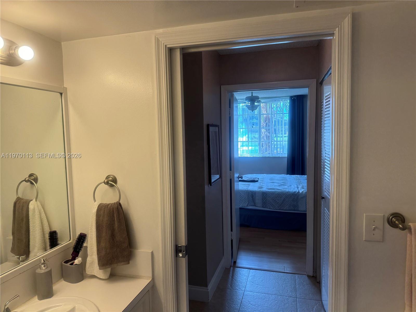 2091 Renaissance Boulevard, Unit 104 Miramar, FL 33025 - Photo 26 of 31 a bathroom with a tub and a sink