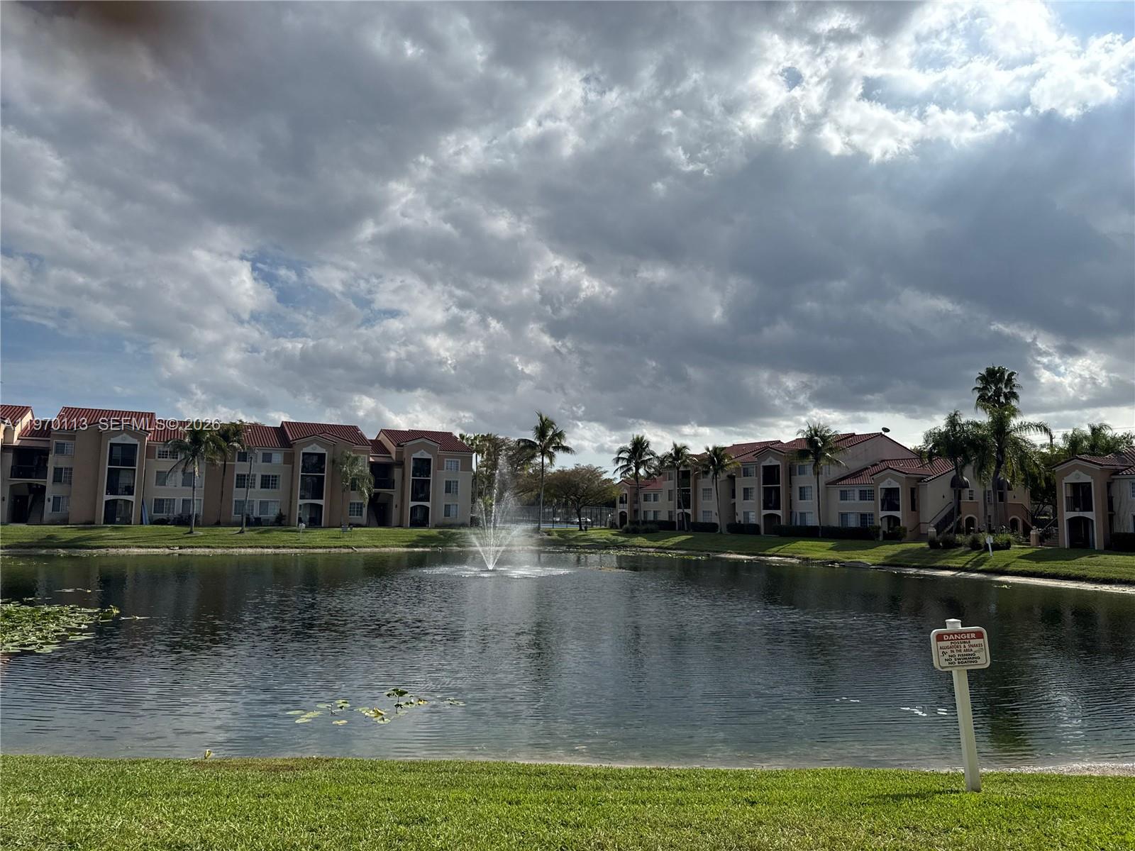 2091 Renaissance Boulevard, Unit 104 Miramar, FL 33025 - Photo 30 of 31 a view of a lake with houses