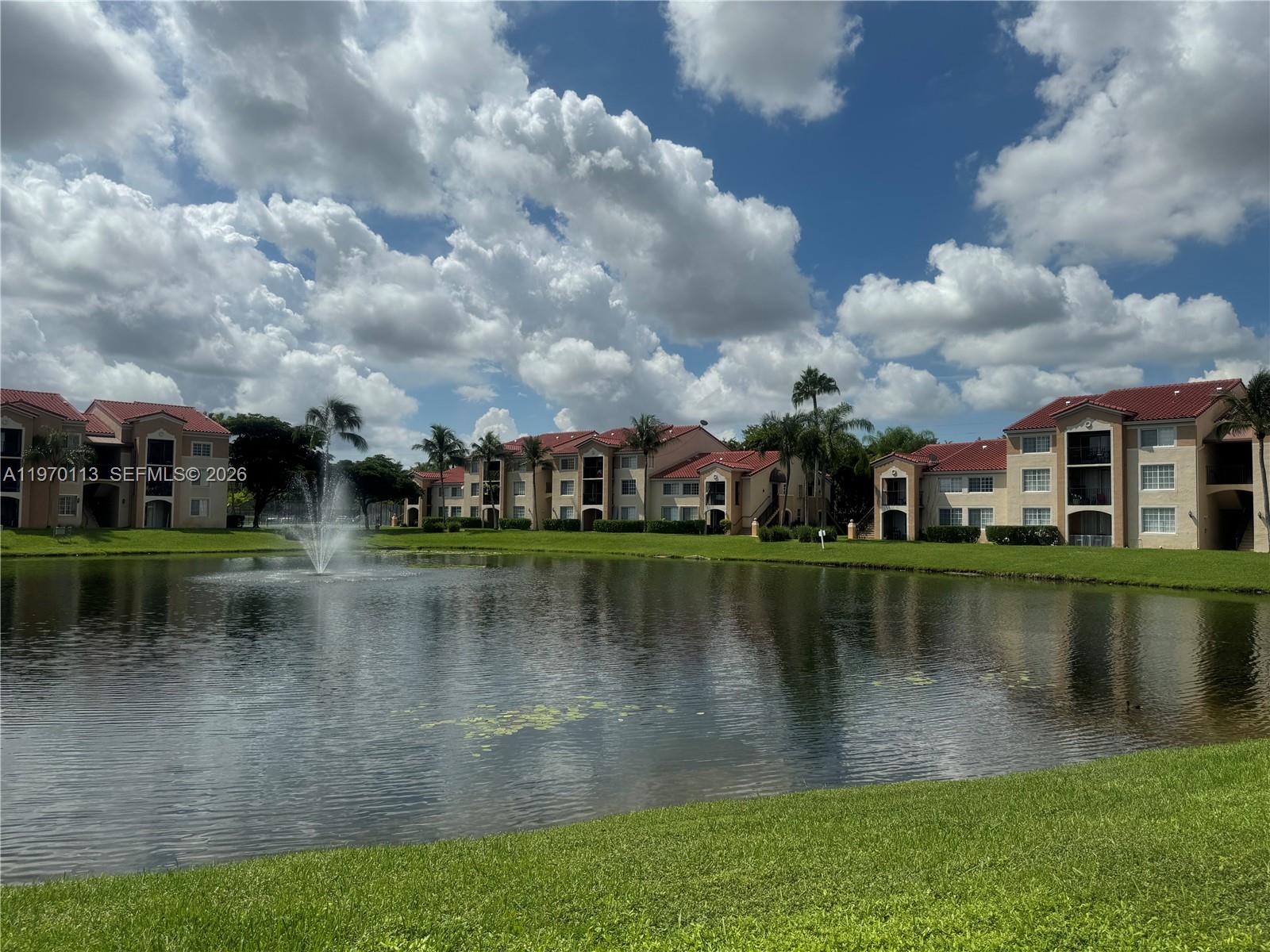 2091 Renaissance Boulevard, Unit 104 Miramar, FL 33025 - Photo 31 of 31 a view of a lake with houses in the background