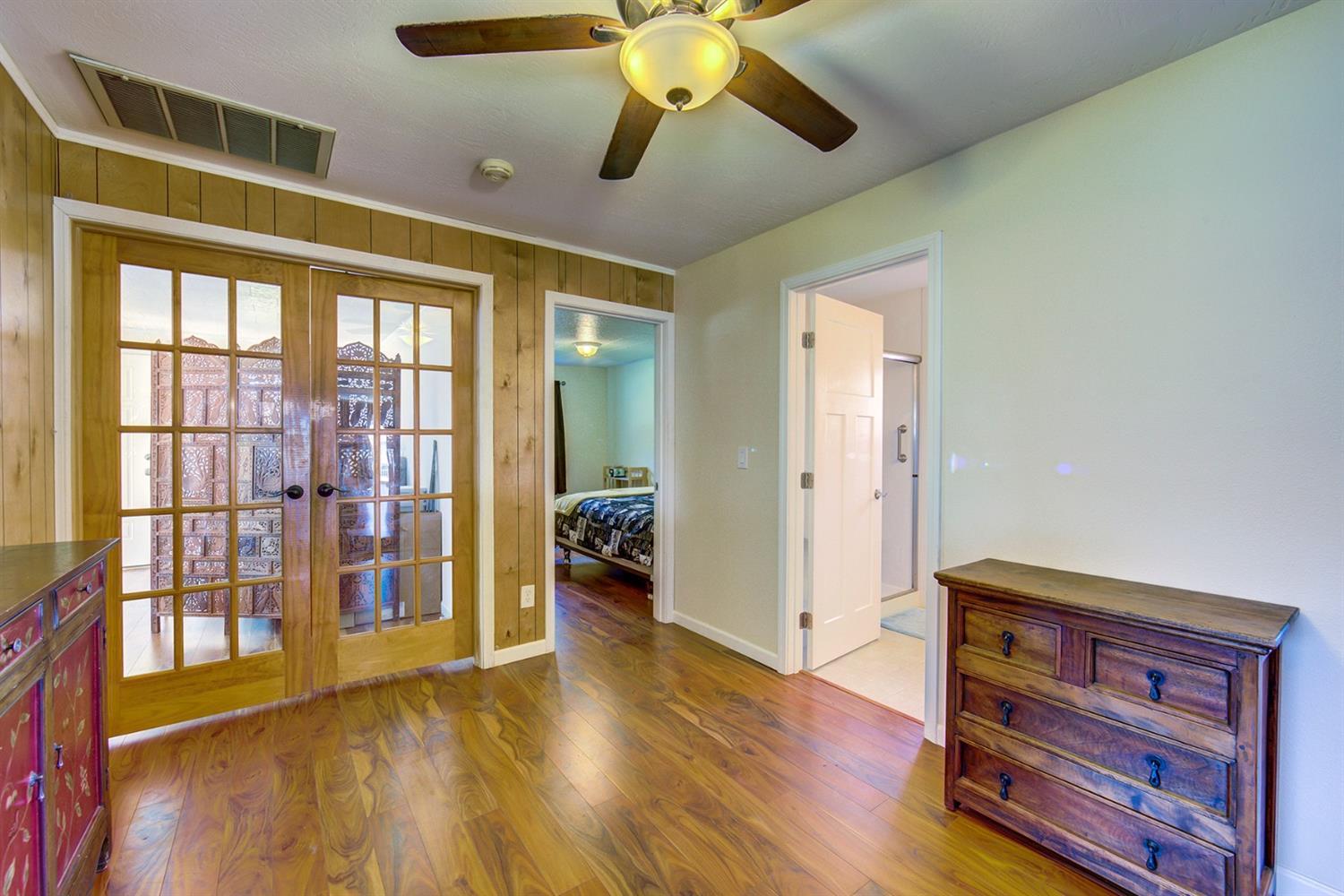 4149 Hilsinger Road Phoenix, OR 97535 - Photo 12 of 35 a view of an empty room with window and wooden floor