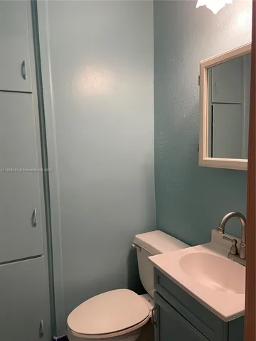 a bathroom with a sink a toilet