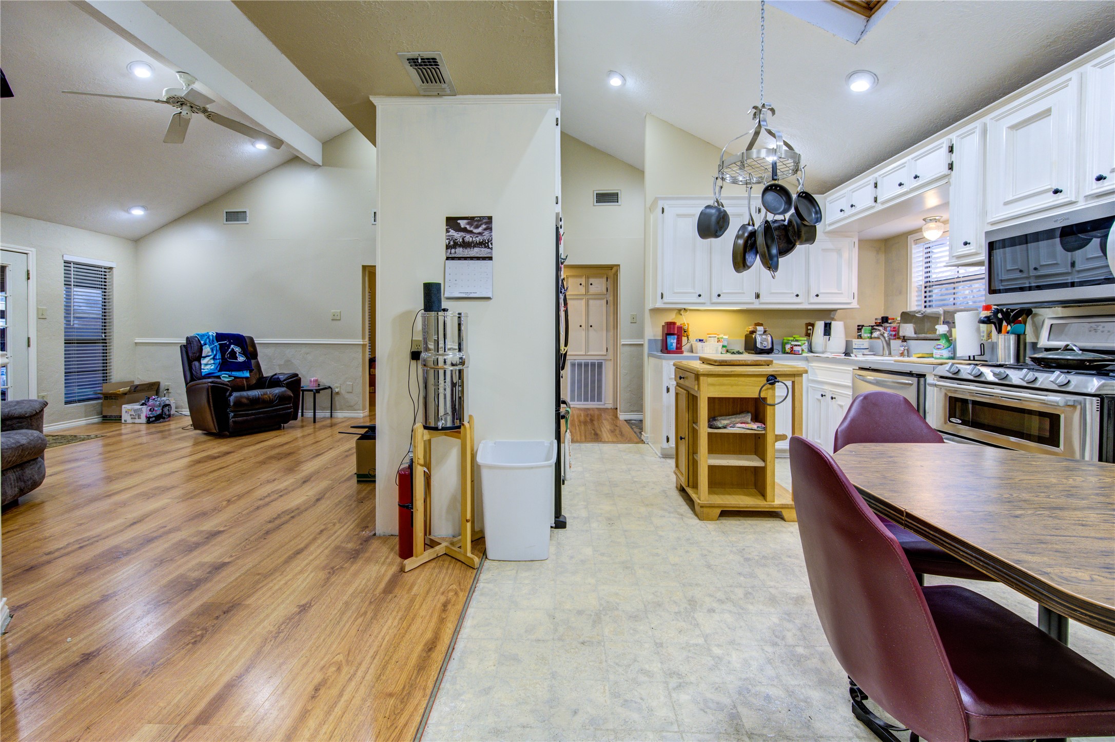 11217 Todd Street Houston, TX 77055 - Photo 16 of 49 a large kitchen with stainless steel appliances lots of counter space and wooden floor