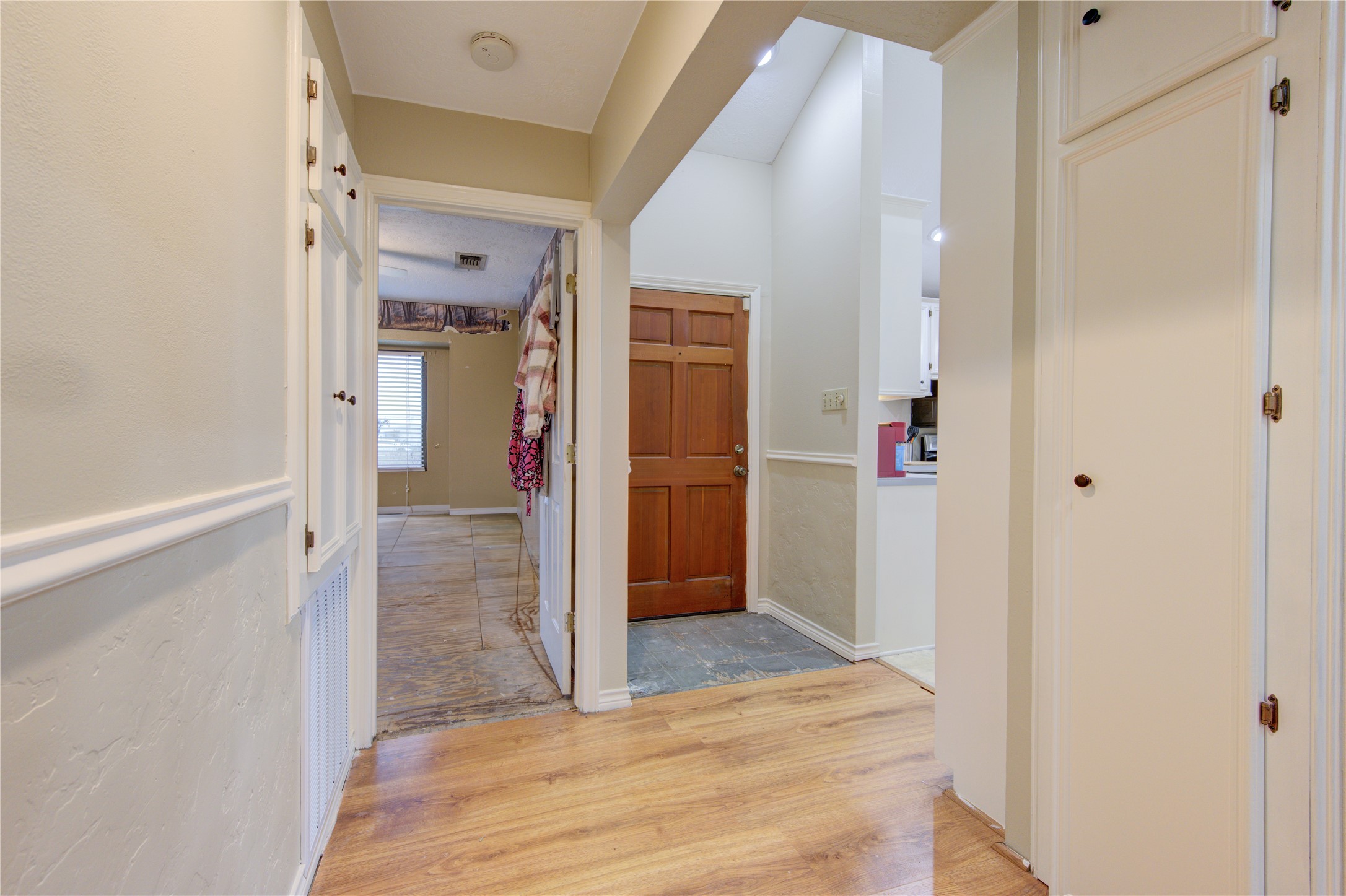 11217 Todd Street Houston, TX 77055 - Photo 21 of 49 a view of a hallway with wooden floor and closet