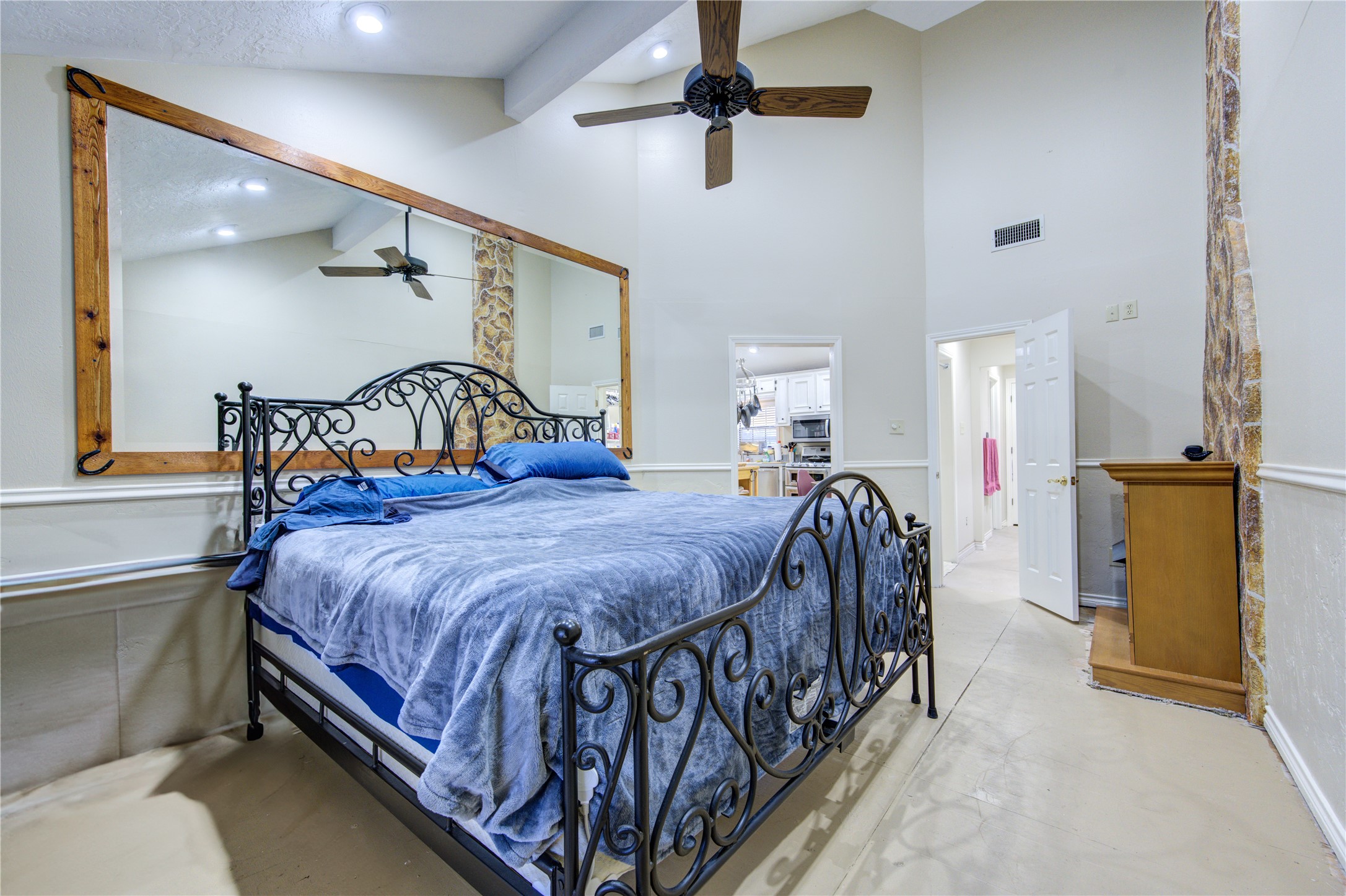 11217 Todd Street Houston, TX 77055 - Photo 22 of 49 a bedroom with a bed and a painting on the wall